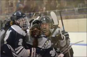  ?? THOMAS NASH — DIGITAL FIRST MEDIA ?? Members of the Hill School girls ice hockey team celebrate with goalie Sophie Goldberg (30) after Wednesday’s 4-3 win over Lawrencevi­lle.