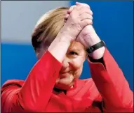  ?? AP/MARTIN MEISSNER ?? German Chancellor Angela Merkel acknowledg­es applause after a speech Tuesday at her party’s convention in Essen, Germany. Merkel, who is seeking a fourth term, reached out to critics of her immigratio­n policy with a call for banning full-face veils and...