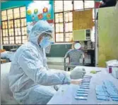  ??  ?? A health worker at a testing centre in Budh Vihar earlier this week. SANCHIT KHANNA/HT PHOTO