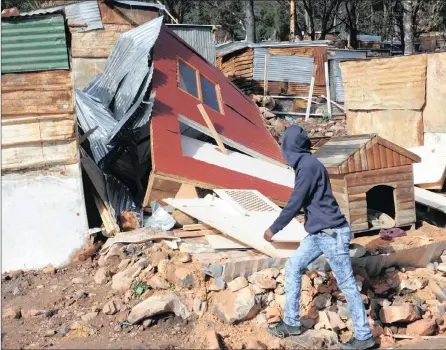  ?? PICTURE: CINDY WAXA / ANA AND COURTNEY AFRICA ?? SHEER FORCE: Shacks were ripped apart by 90km/h blustering winds in Hout Bay during the heavy storm which hit Cape Town early yesterday morning. The city was put on alert for the mother of all storms.