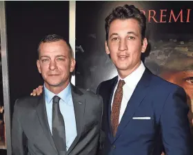  ?? GETTY IMAGES ?? Miles Teller (right) portrays Adam Schumann (left) in “Thank You for Your Service.” The pair posed at a screening of the movie in Los Angeles Monday.