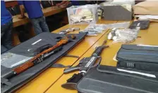  ?? (THIRD MALONZO) ?? MANILA. Firearms and other items seized from National Democratic Front of the Philippine­s consultant Vic Ladlad.