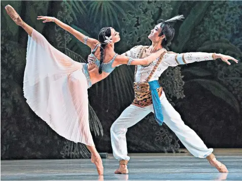  ??  ?? Commendabl­e: Viktoria Tereshkina and Kimin Kim as Nikiya and Solor in the Mariinsky’s La Bayadère Moore to say: the American documentar­y maker puts on an affecting political variety show with a personal touch