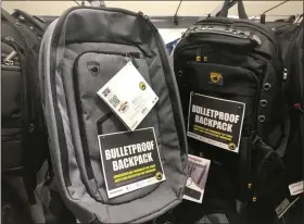  ?? TERESA CRAWFORD - ASSOCIATED PRESS ?? This Thursday photo shows bulletproo­f backpacks that for sale at an Office Depot store in Evanston, Ill.. With the rise of mass shooting, companies like Guard Dog Security, TuffyPacks and Bulletbloc­ker are creating bullet-resistant backpacks for children for the back-to-school shopping season. Many say they’re seeing an increase in sales in their products leading up to the fall, and typically see a spike in sales after a mass shooting.
