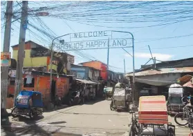  ??  ?? DOE- IDENTIFIED houses in Happy Land in Manila were among the beneficiar­ies of the intensifie­d electrific­ation activities.