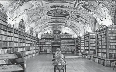  ?? RICK STEVES/RICK STEVES’ EUROPE ?? Prague’s Strahov Monastery library was a center of Baroque learning.