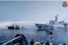  ?? ?? A still taken from video footage released by the Philippine coastguard on Saturday shows a Chinese coastguard ship using a water cannon on a Philippine fisheries vessel near Scarboroug­h Shoal in the disputed South China Sea. Photograph: Philippine Coast Guard/AFP/Getty Images