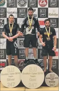  ?? Oban BJJ’s Gregory Black, centre, with his gold medal. ??