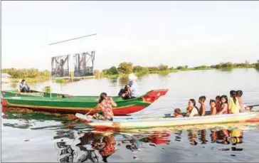  ??  ?? Zalmai’s photograph­ic exhibition on the lives of those in floating communitie­s is underway.