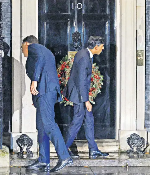  ?? ?? After greeting one another on the steps of No 10, Rishi Sunak and Dutch PM Mark Rutte were left bemused when they were locked out. The door was eventually opened