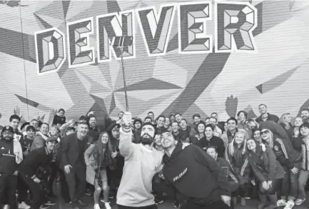 ?? John Leyba, The Denver Post ?? The Rapids introduce two new players — Jack Price, center left, and Edgar Castillo, center right — to fans in front of a mural in downtown Denver on Monday.