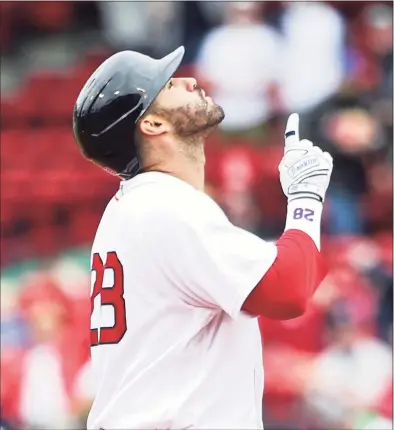  ?? Kathryn Riley / Getty Images ?? The Red Sox’s J.D. Martinez reacts after hitting a two RBI double in the fifth inning against the Rays on Wednesday at Fenway Park.