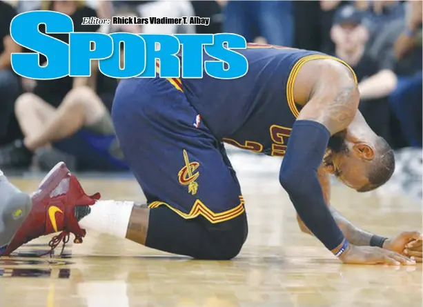  ?? AP ?? Cleveland star LeBron James writhes on the floor in pain after taking an elbow to the neck during the Cavaliers meltdown at the hand of the San Antonio Spurs on Monday.