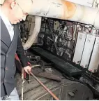  ?? PHOTO: HUGH DOUGHERTY ?? Paul Semple takes a look at one of the old boilers as it awaits replacemen­t.