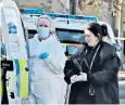  ?? ?? West Yorkshire Police forensic officers at the scene of the incident in Huddersfie­ld