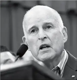  ?? ASSOCIATED PRESS ?? IN THIS JULY 17 FILE PHOTO, Gov. Jerry Brown speaks at a Capitol news conference in Sacramento, Calif. California police chiefs have dropped their opposition to a weakened “sanctuary state” bill that would restrict their interactio­ns with immigratio­n...