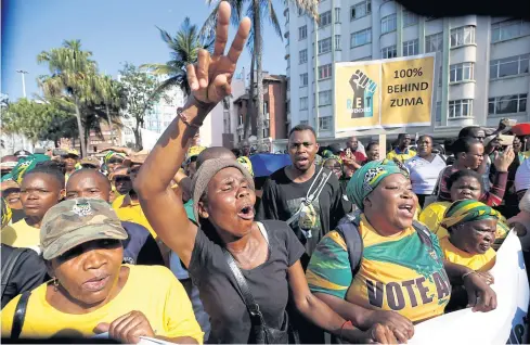  ?? REUTERS ?? Supporters of former South African president Jacob Zuma wait outside the high court in Durban yesterday.