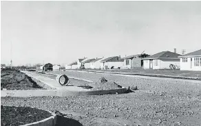  ??  ?? Homes under constructi­on in Devon in 1948, a town that sprang up with the discovery of oil and the constructi­on of the Leduc No 1 oil well.