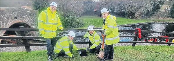  ?? PHOTO: CRT ?? Canal & River Trust chief executive Richard Parry, left, meets apprentice­s at Bratch Locks on the Staffordsh­ire & Worcesters­hire Canal.