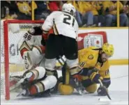  ?? MARK HUMPHREY — THE ASSOCIATED PRESS FILE ?? In a Tuesday file photo, Nashville Predators right wing James Neal (18) battles in front of the goal against Anaheim Ducks goalie John Gibson (36) and right wing Chris Wagner (21) during the second period in Game 3 of the Western Conference final in...