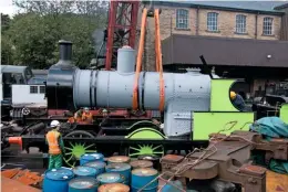  ?? ROBERT BATTY ?? The boiler being returned to the frames of Lancashire & Yorkshire Railway ‘Ironclad’ 0-6-0 No. 957 at Haworth on August 31.