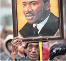  ?? JIM WEBER / THE COMMERCIAL APPEAL ?? Osie James joins other marchers in the annual Martin Luther King Jr. Holiday Parade.