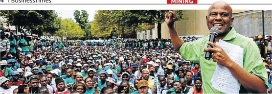  ?? Picture: MOELETSI MABE ?? BOOMING NUMBERS: Amcu president Joseph Mathunjwa addresses union members gathered for a rally outside Impala Platinum’s Sandton offices during wage negotiatio­ns. The union now has about 200 000 members across a range of sectors, many of whom deserted...