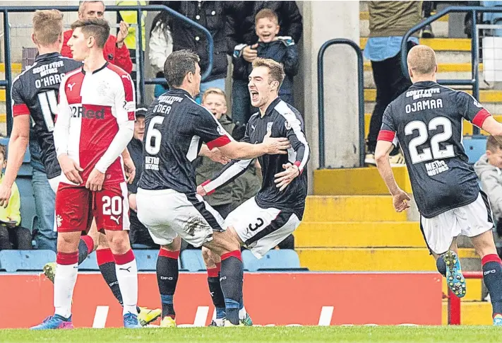  ?? Pictures: SNS/PA. ?? Kevin Holt celebrates with captain Darren O’Dea after his free-kick beat Rangers keeper Wes Foderingha­m to give Paul Hartley’s men a 2-0 lead.