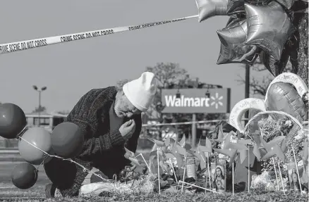  ?? Kenny Holston/new York Times ?? A makeshift memorial sits outside a Walmart where a Walmart supervisor shot and killed six of his co-workers, including a 16-year-old, late Tuesday in Chesapeake, Va. Two others who were shot remained hospitaliz­ed, police said Friday.