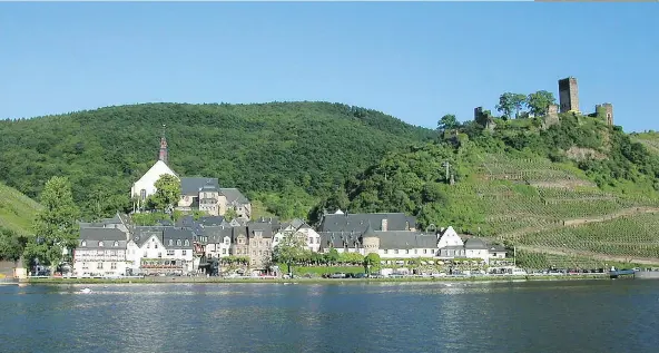  ?? RICK STEVES/RICKSTEVES.COM ?? Envisionin­g a route and timeline might include striking a balance between big cities and tranquil villages, like Beilstein, above, in Germany’s Mosel Valley.