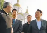  ?? OFFICE OF THE PROSECUTOR GENERAL OF UKRAINE VIA AP ?? South Korean President Yoon Suk Yeol (right) and Ukraine Prosecutor General Andriy Kostin (left) talk in Bucha, outside Kyiv, Ukraine, Saturday.