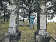  ?? File photo/Arkansas Democrat-Gazette/MITCHELL PE MASILUN ?? History Commission­er Kristal Clark talks in May 2016 about the history of some of the people buried at Thomas Cemetery. The North Little Rock cemetery is about to undergo a preservati­on effort.