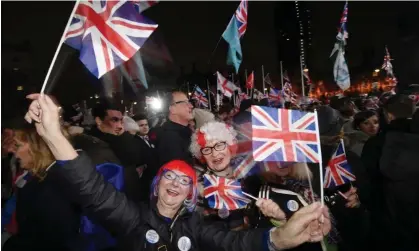  ?? ?? Pro-Brexit supporters celebrate outside parliament in London on 31 January 2020. Photograph: Neil Hall/EPA