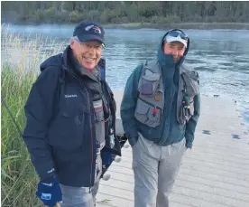  ?? Photo / File ?? Simon Dickie (left) pictured fly fishing in 2014.