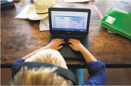  ?? LISA MAREE WILLIAMS GETTY IMAGES ?? Zoom and other online services have quickly become a prominent component in most online teaching, but many school districts have safety concerns.