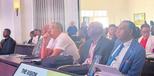  ?? PHOTO BY CHRISTOPHE­R THOMAS ?? (In the foreground from left): Health Minister Dr Christophe­r Tufton; Patrick Hylton, chairman of the University Hospital of the West Indies’ board of management; and Wilford ‘Billy’ Heaven, chief executive officer of the CHASE Fund, sit together during the 22nd annual Caribbean Neuroscien­ces Symposium, held at the Half Moon hotel in Montego Bay, St James, on Friday.