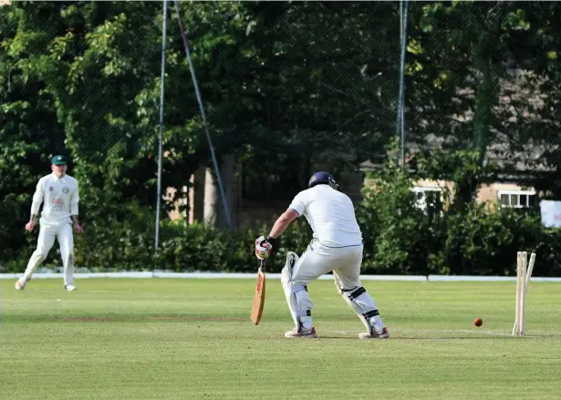  ?? Dave Turner ?? ●●Ashley batsman Imran Butt is bowled by Peter Richards during Hawk Green’s victory at the weekend