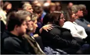  ?? PHOTOS BY RICK WOOD / MILWAUKEE JOURNAL SENTINEL ?? Church members comfort one another as they listen to Pastor Mark Weigt at The Ridge Community Church in Greenfield.