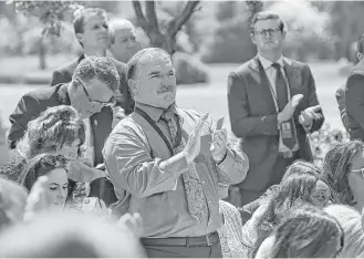  ?? Lisa Krantz / San Antonio Express-News ?? Sutherland Springs survivor David Colbath stands to applaud at the conclusion of President Donald Trump's remarks during the National Day of Prayer service at the White House.