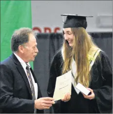  ?? ASHLEY THOMPSON ?? Governor’s General Award recipient Madeleine Macdonald accepts her medal from presenter Bob Best.