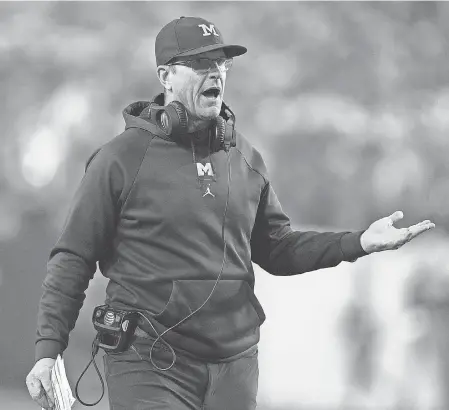  ?? KIRBY LEE/ USA TODAY SPORTS ?? Michigan head coach Jim Harbaugh, gesturing from the sideline during this season’s College Football Playoff Fiesta Bowl semifinal game against TCU, has led the Wolverines to the CFP the past two seasons.