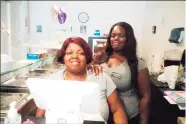  ?? Emily M. Olson / Hearst Connecticu­t Media ?? Tequanna’s Soul Food & Sweets owner Tequanna Tyson, right, cooks her homemade food with her mother, Regina.