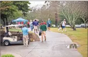  ??  ?? Shorter University students worked with the Rome Floyd Commission on Children and Youth for their 26th Annual Golf Classic. The Hawks helped with check in and even rode all 18 holes and to place sponsor signs at each tee box.