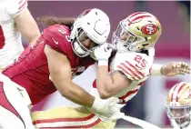  ?? AFP PHOTO ?? ■ Elijah Mitchell (25) of the San Francisco 49ers carries the ball against the Arizona Cardinals during the fourth quarter at Estadio Azteca on Monday, Nov. 21, 2022 (November 22 in Manila), in Mexico City.