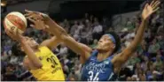  ?? CARLOS GONZALEZ — STAR TRIBUNE VIA AP ?? Minnesota Lynx Sylvia Fowles, right, defends Nneka Ogwumike of the Los Angeles Sparks, left, in the first quarter of a WNBA basketball game Sunday Minneapoli­s, Minn.