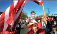  ?? AP PHOTO BY KENT PORTER ?? In this April 2 file photo, Guadalupe Suarez, of Santa Rosa, joins United Farm Worker supporters participat­ing in the annual Cesar Chavez/ufw march in Santa Rosa.