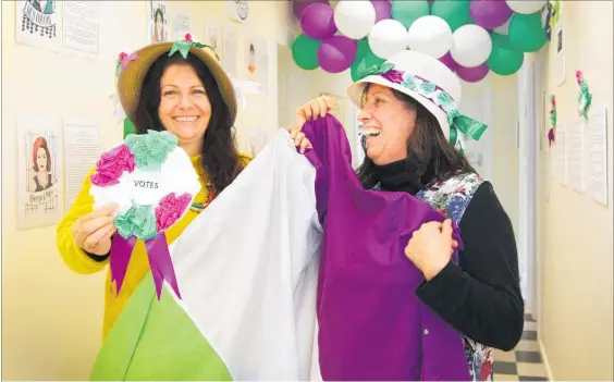  ?? PHOTO: DUNCAN BROWN ?? Heretaunga Women’s Centre service coordinato­r Cathy Barclay (left) and manager Margot Wilson preparing a display for upcoming Suffrage Day events.