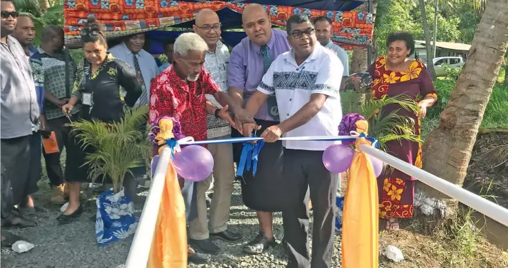  ?? Photo: Laisa Lui. ?? Minister for Agricultur­e, Rural and Maritime Developmen­t, Waterways and Environmen­t Mahendra Reddy (third from right) at the official opening of the foot-crossing at Nasekula Village in Labasa on October 30,2019.