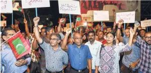  ?? AP ?? In this Sunday, February 4 photo, Maldivian opposition supporters shout slogans during a protest as they the urge the government to obey a Supreme Court order to release and retry political prisoners, including an ex-president in Male, Maldives. The...