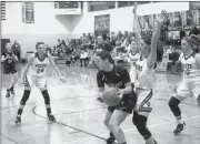  ?? Photo by Bob Parana ?? North Clarion's Maria Bauer guards Ridgway's Grace Bon during her team's 49-33 D9 Class A quarterfin­al win on Thursday in Tionesta. The Lady Elkers play Clarion in the consolatio­n semifinals on Monday at St. Marys High School. The She-Wolves play at Elk County Catholic on Tuesday.